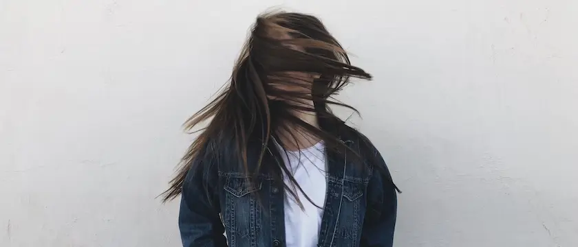Woman with blurred hair over her face.